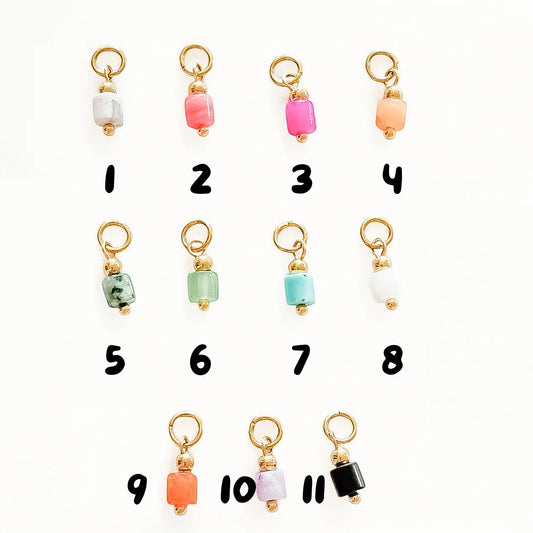 Photo des différents modèles de charm perle colorée de la marque Gigi Pop