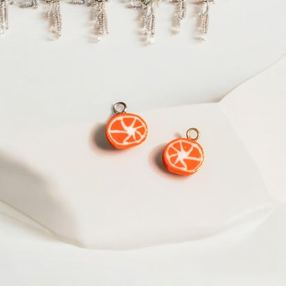 Photo de deux charms tranche d'orange